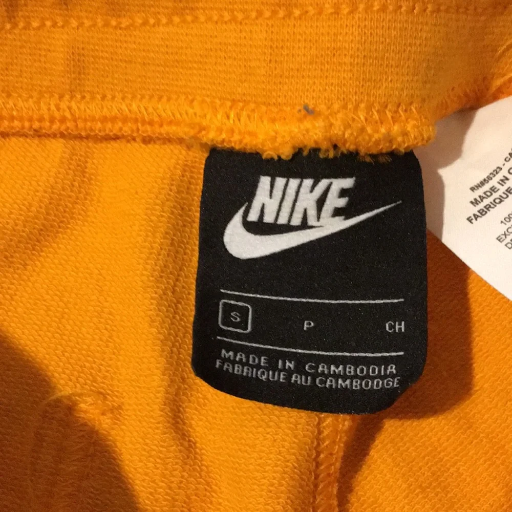 Nike Orange Men's Athletic Shorts with White Logo